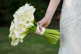 Bride Holding Elegant Calla Lily Bouquet with Pearl Accents