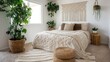 © Chenda - Relaxed boho bedroom featuring macrame wall art and natural fiber rugs