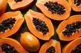 Vibrant, fresh papaya halves, whole fruits artfully arranged, healthy diet concept. Bright orange flesh, black seeds create visually appealing display of natural, organic food. Abundant collection