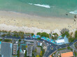 Aerial top view over Patong beach dolphin circle.
The dolphin roundabout is at the end of Patong Beach, next to Kalim Beach.
beach crowded with tourists.
