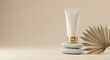 © Item.io - A cosmetic tube rests atop stacked stones, alongside a dried palm leaf, against a beige background.