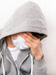 © Sabphoto - Sad Young Man in Flu Mask