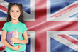 © New Africa - Little girl with notebooks against flag of United Kingdom. Language school