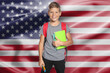© New Africa - Little boy with backpack and stationery against flag of USA. Language school