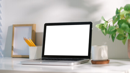 Wall Mural - Home office desk setup with laptop and copy space for advertising or branding.