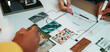 © InfiniteFlow - A team collaborates on an interior design project, sketching a floor plan while using color swatches and samples to enhance their creative process and ideas. SACTR
