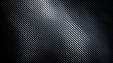 Black carbon fiber texture showing smooth and reflective pattern with diagonal lines and depth, ideal for design inspiration