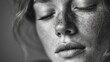 © Leisj - Close-up grayscale portrait of a woman with freckles