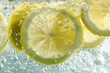 © jiyacreatives - Vibrant lemon slices submerged in sparkling water, creating a refreshing and invigorating visual for beverages and health content.
