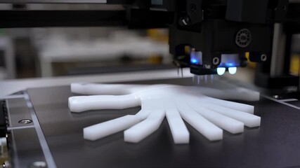 Wall Mural - 3d printer creating a white plastic hand prosthesis