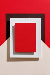 Wall Mural - overlapping textured paper sheets in red, white, brown, and beige create a vibrant abstract backgrou