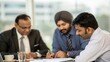 © N7 - Indian executives around table with blurred focus — teamwork and investment planning