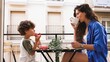 © DMegias - Mother and son enjoying breakfast on balcony: sharing a peaceful moment