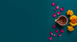 © Loki Stock - Hindu festival flat lay with a lit diya lamp and flower petal a concept for diwali celebration worship culture and spiritual tradition