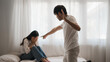 © PaeGAG - Furious man scolding crying woman in bedroom