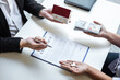 © Ngampol - Estate agent sending house model to client after signing agreement contract real estate with approved mortgage application form, concerning mortgage loan offer for and house insurance
