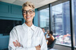 © Jacob Lund - Portrait of a happy business woman standing in a boardroom during a meeting