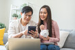 © KMPZZZ - Happy asian young couple love calculate and putting coin in piggy bank for saving money to buy real estate for new home. Business finance, deposit with banking for financial planning future together.