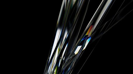 Glass rods are rotating, creating an abstract and visually appealing composition against a black background, with colorful highlights adding an element of intrigue