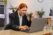 © Andrii Iemelianenko - Young businesswoman at home office sees laptop screen freeze slaps table grabs head stressed. Freelancer girl at table hits ctrl alt del waits anxious hoping system recovers soon to keep working again