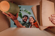 © Zamrznuti tonovi - Happy couple unpacking cardboard box in new home