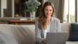 © Nataliya - A woman joins a video call, the professional scene illuminated by soft light. Woman, laptop, with copy space