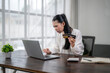 © Apichat - Stressed asian businesswoman having problems paying with credit card online