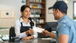 © Ruls.Design - Smiling Store Clerk Accepting Check from Customer at Counter