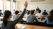 © ProArt Studios - Rear view of an attentive female student raising her hand in a brightly lit classroom, seeking to answer a question during a lecture.
