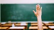 © Daunhijauxx - Student's Hand Raised in Classroom for Participation and Learning