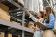© Art_Photo - Female engineers team discussing inventory in warehouse logistics and supply chain planning, operation management, data analysis, warehouse shipping, inventory tracking, optimization and technology