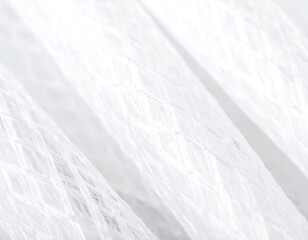 Close-up of white plastic tubing with a net-like texture