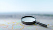 © DOUGLAS - Magnifying glass map navigation search exploration focus travel city planning discovery and curiosity concept