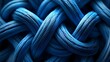 © Sadix - Photograph of intertwined blue yarn creating a complex, looping texture.