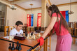 © ADDICTIVE STOCK - Girl in chess match with boy at the table
