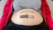 © ADDICTIVE STOCK - Pregnancy humor with a baby bump progress bar