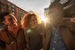 © bernardbodo - Three happy male friends laughing together at sunset in New York City