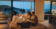 © Jacob Lund - Close friends enjoying a dinner sharing laughs at a home with city view