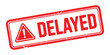 © AFAZ - Red and white distressed stamp with the word delayed and a warning symbol