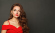 © artmim - Successful woman with long hair and make-up on black background. Gorgeous woman with curly hairstyle