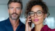 © Nataliia_Trushchenko - Man and a woman are talking on a cell phone. The woman is wearing glasses and has a smile on her face