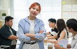 © saksit - Portrait young Asian business man with team in a modern office meeting for startup seminar, teamwork, and training session, showing collaboration, professionalism, and creative business environment.