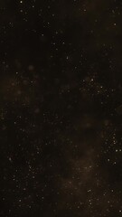 Wall Mural - Luxury background with glittering shiny gold particles and shimmering bokeh light. Elegant golden vertical background ideal for glamorous events, award ceremonies or talent shows. 
