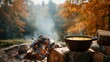 © fivan - Forest soup moment: pot of soup over outdoor fire pit, surrounded by firewood and foggy autumn foliage in background