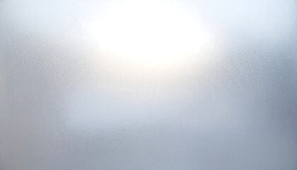 Soft, diffused light illuminating a hazy, blurred background with a bright white glow at the top
