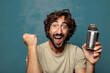 © kues1 - young adult bearded man with a steel open can