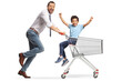 © Ljupco Smokovski - Father pushing son in a shopping cart and smiling at camera