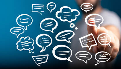 hand pointing at speech bubbles. communication, dialogue, social media concept.