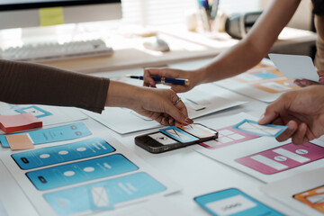 Wall Mural - user experience designers collaborating on a fresh mobile application template, focusing on innovati
