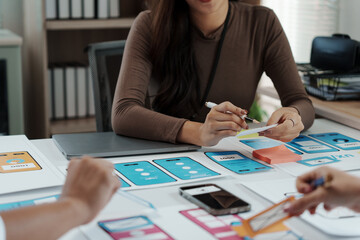Wall Mural - user experience designers are working on user interface of mobile application developing wireframe s